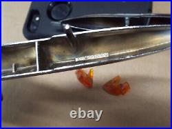 60 Cadillac NOS TOP OF FENDER TURN SIGNAL GUNSIGHT LIGHT BEZEL TRIM R&L